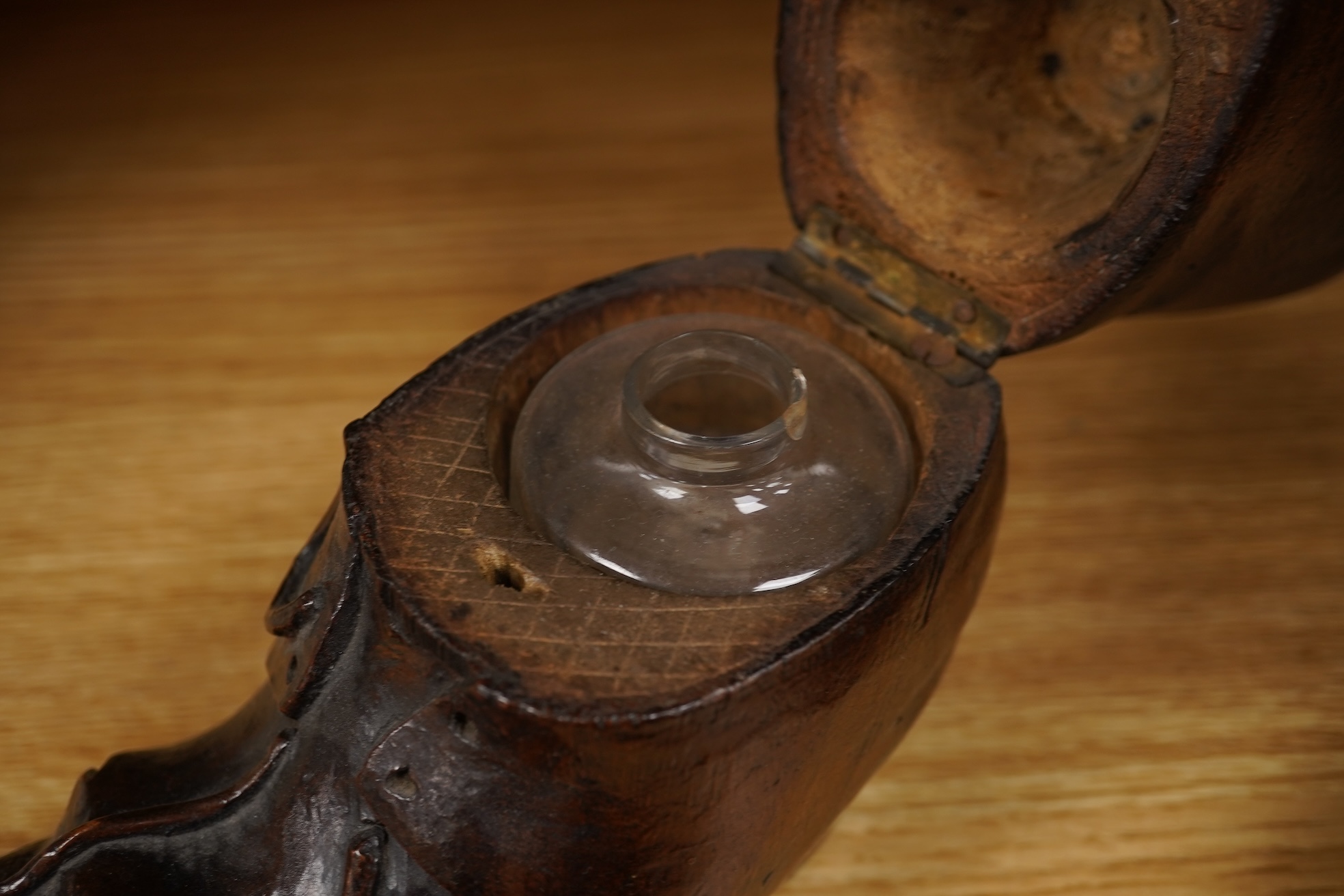 A Black Forest carving of a kitten in a boot inkwell and another car inkwell, tallest 15cm